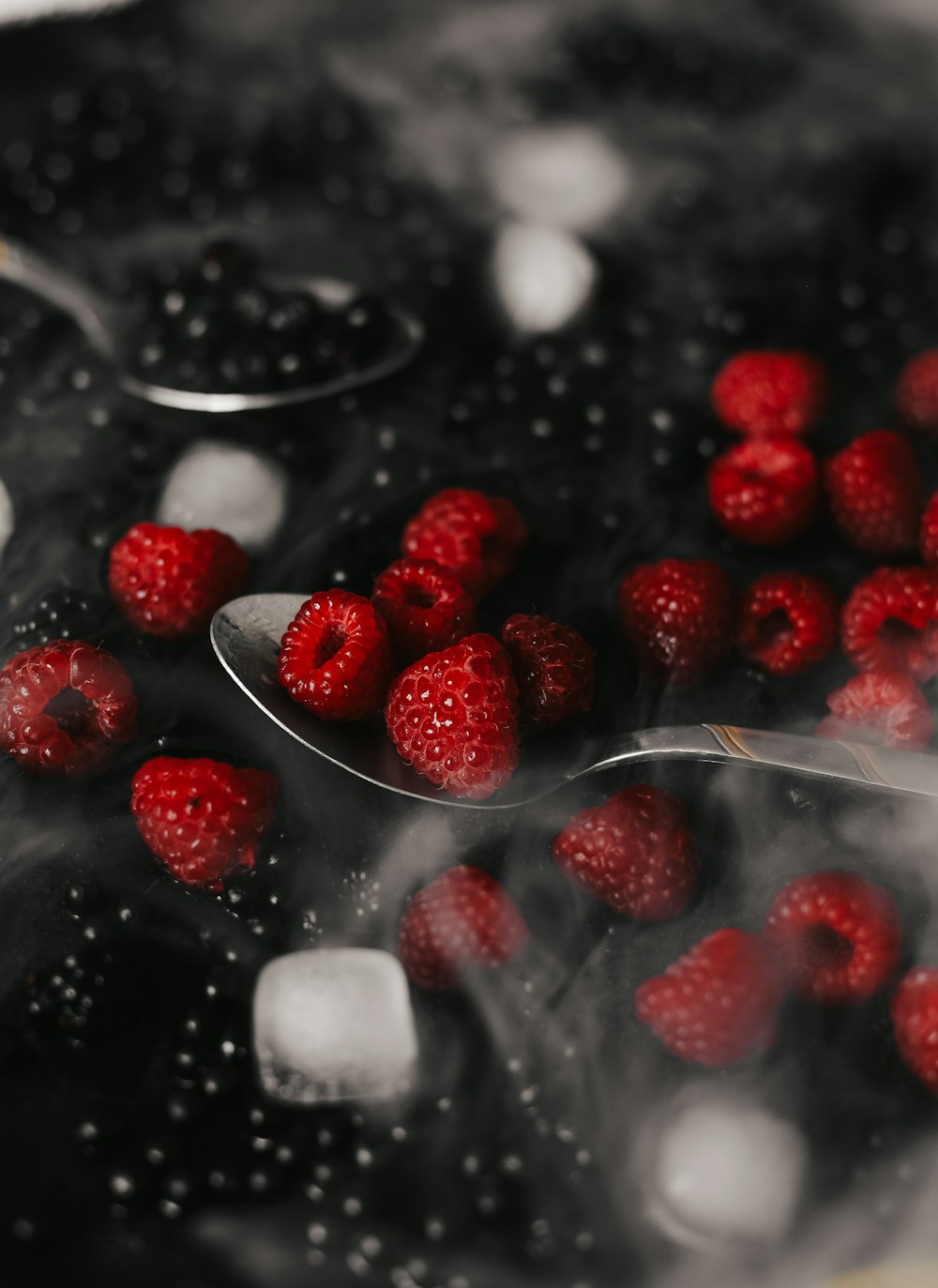 a spoon with red berries