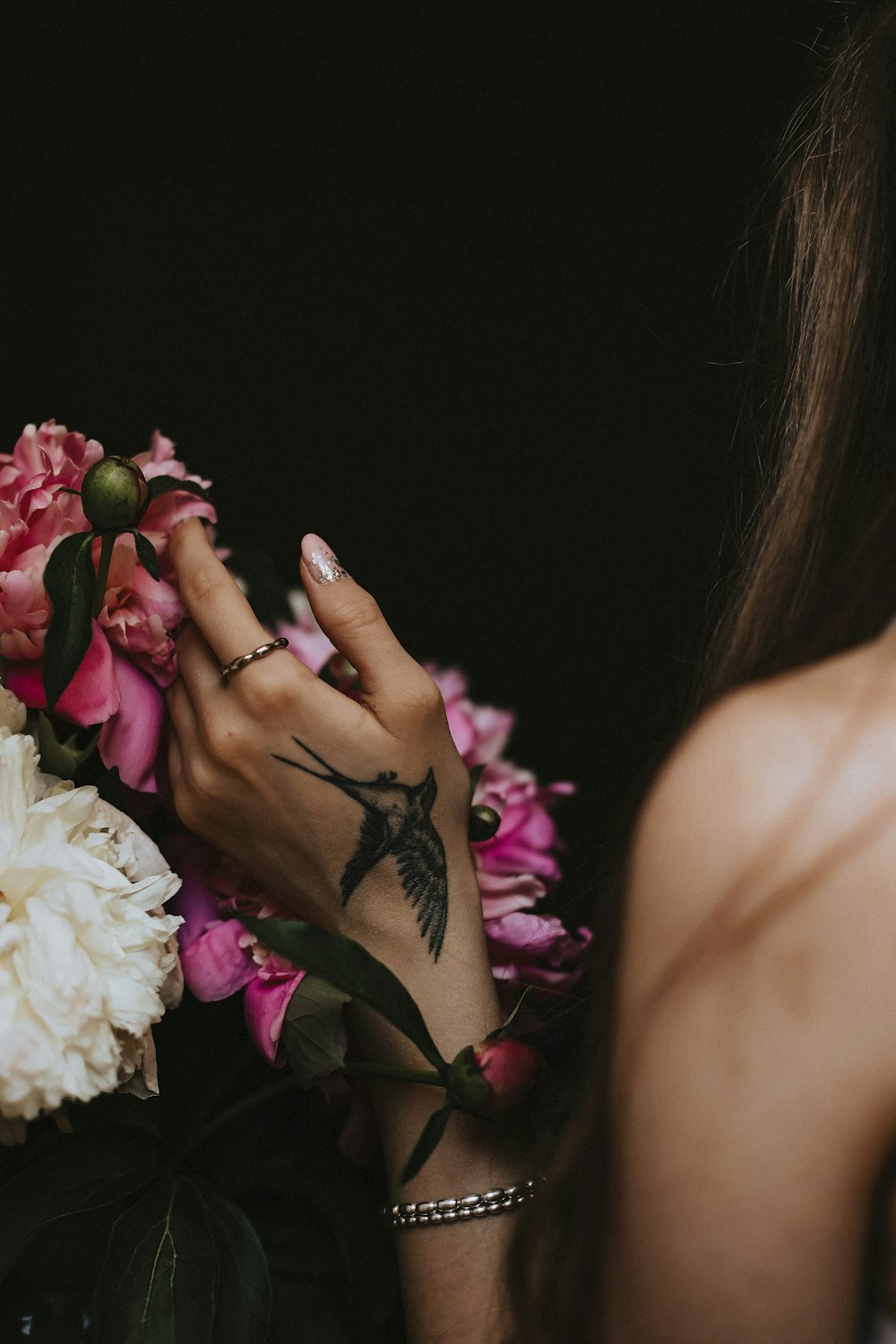 a woman holding flowers