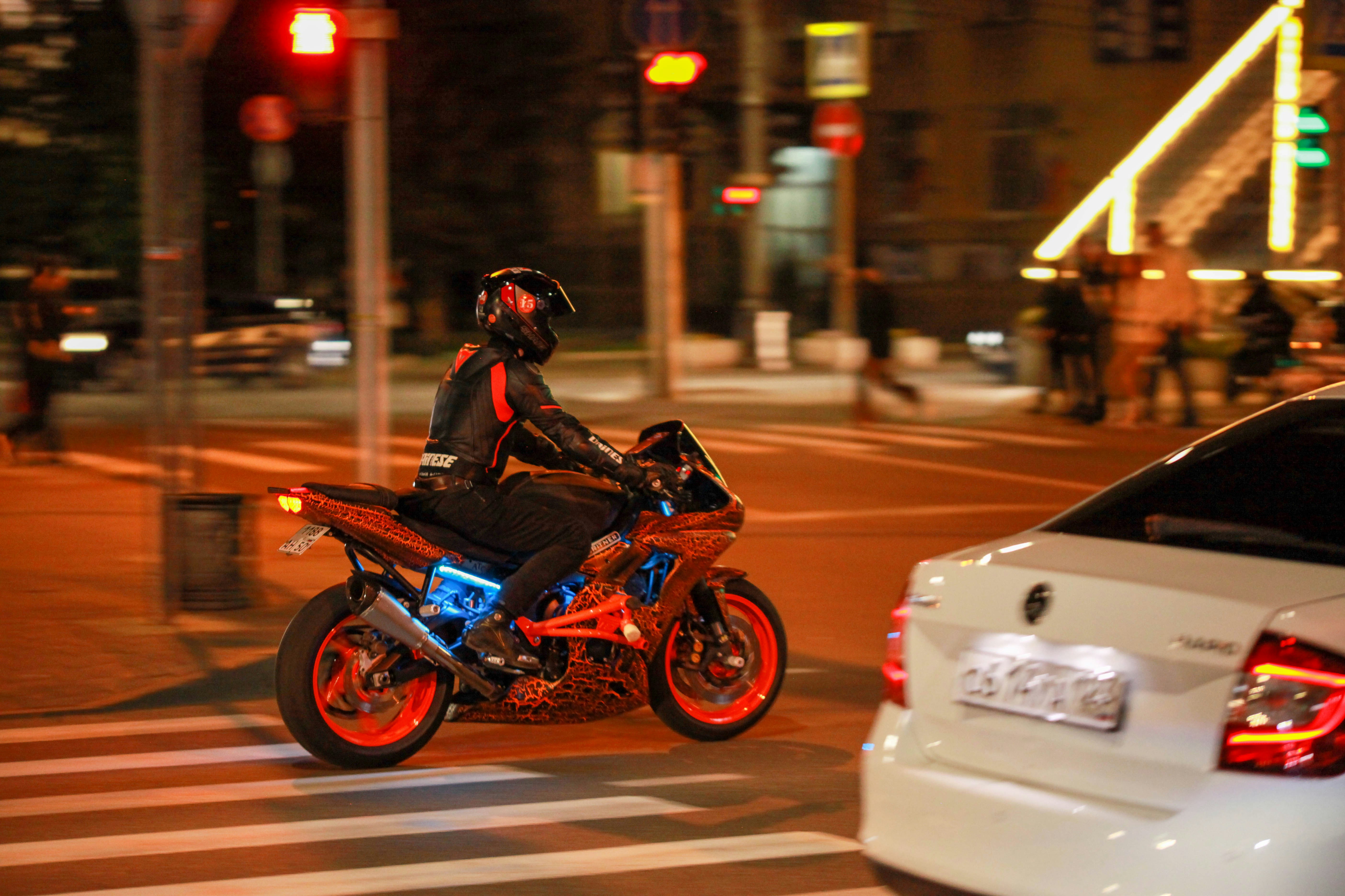 A person riding a motorcycle on the street photo – Free Moto Image on ...