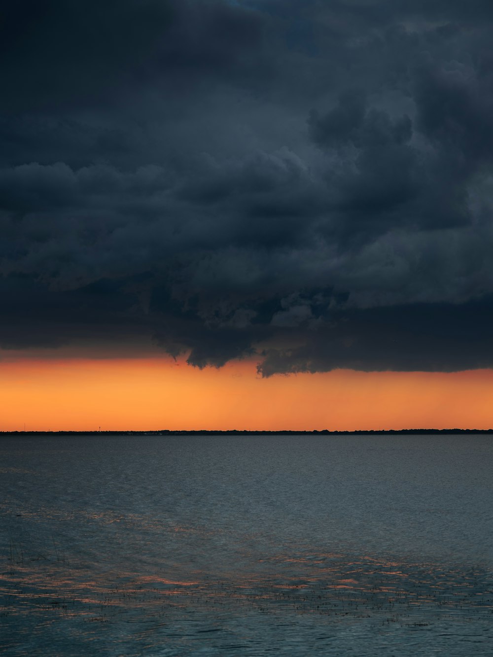 a sunset over a body of water