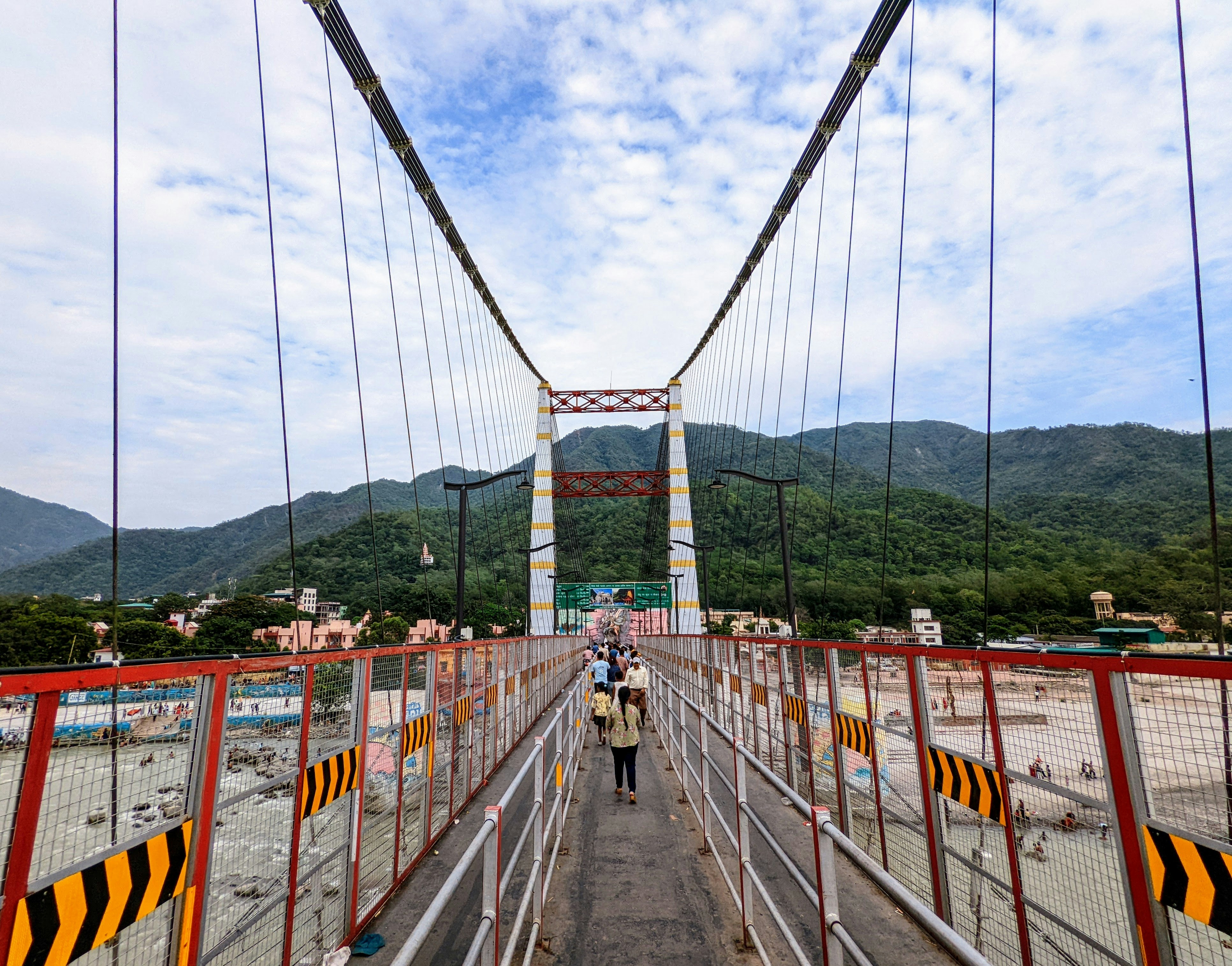 a group of people walking on Aizhai Bridge