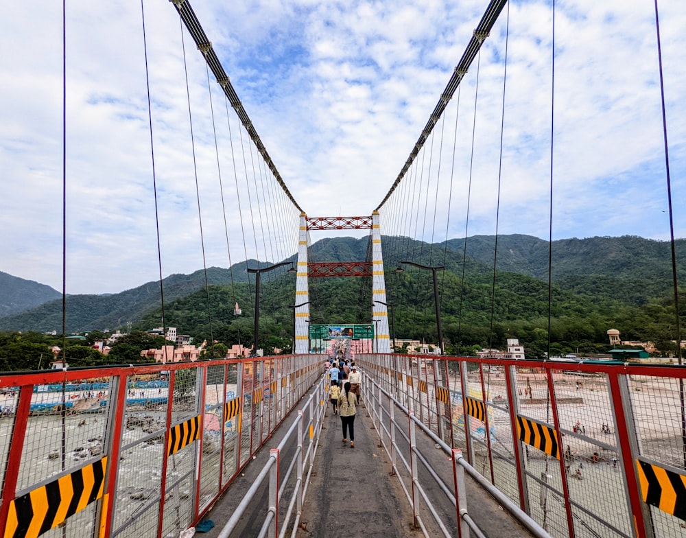 a group of people walking on Aizhai Bridge
