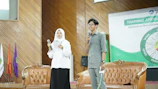 Photo of Murtaza Ibrahimi speaking at a Herstory Initiative Society event.