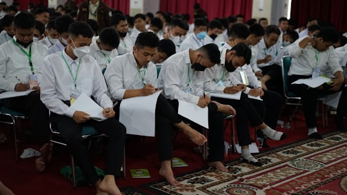 a group of people sitting in chairs
