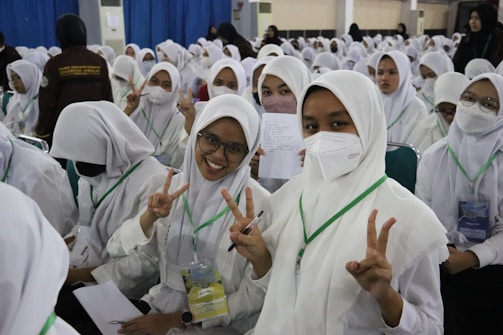a group of women in white robes