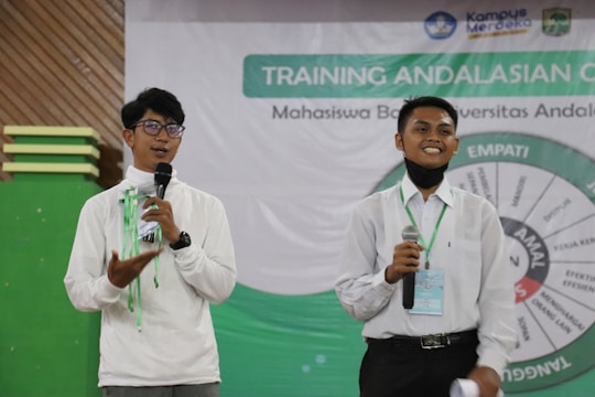 a couple of men holding microphones