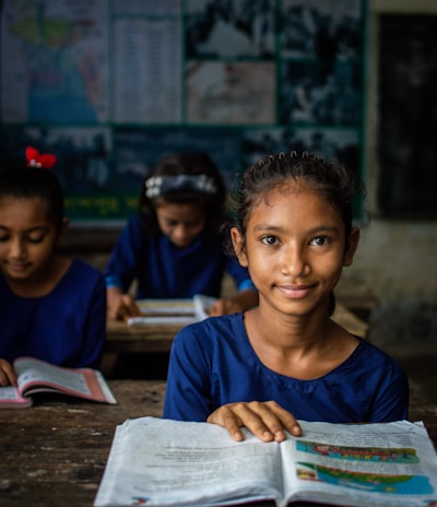 a few young girls in a classroom