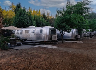 a trailer parked in a dirt field