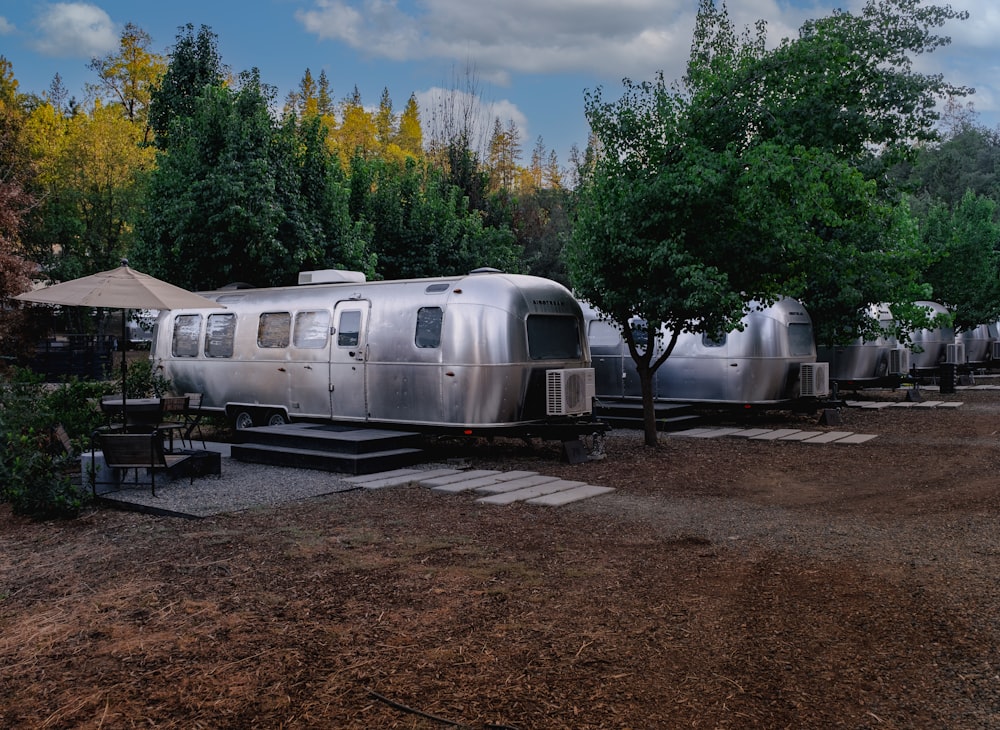 a trailer parked in a dirt field