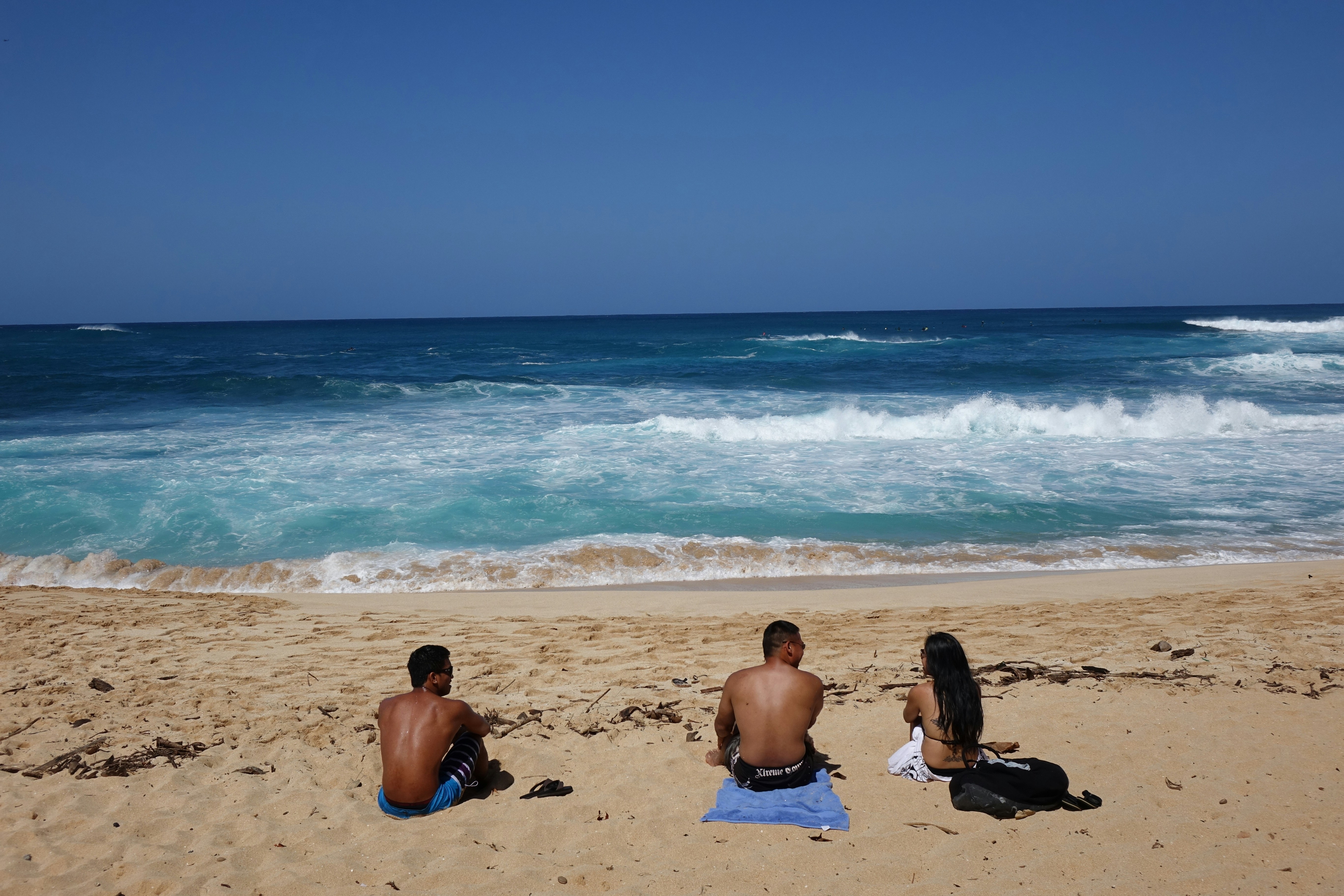 people sitting on a beach