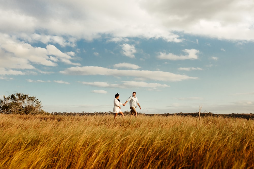 two people running in a field