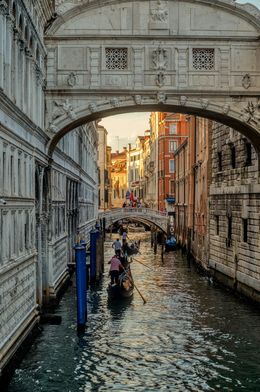 a person riding a bicycle under Bridge of Sighs