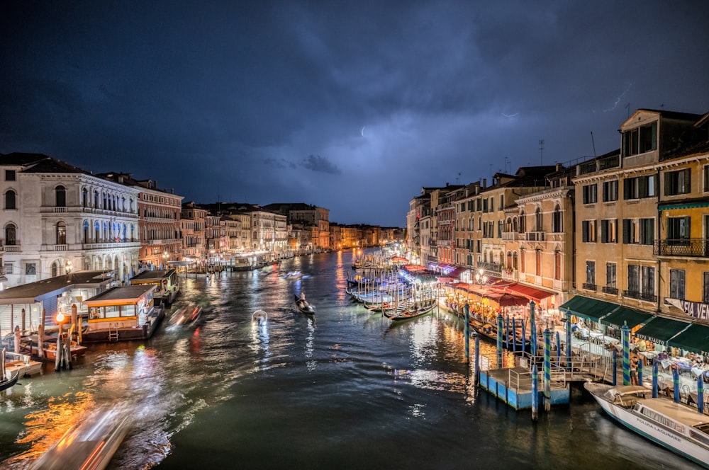 a canal with boats and buildings