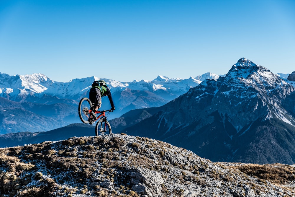 a person riding a bike on a mountain