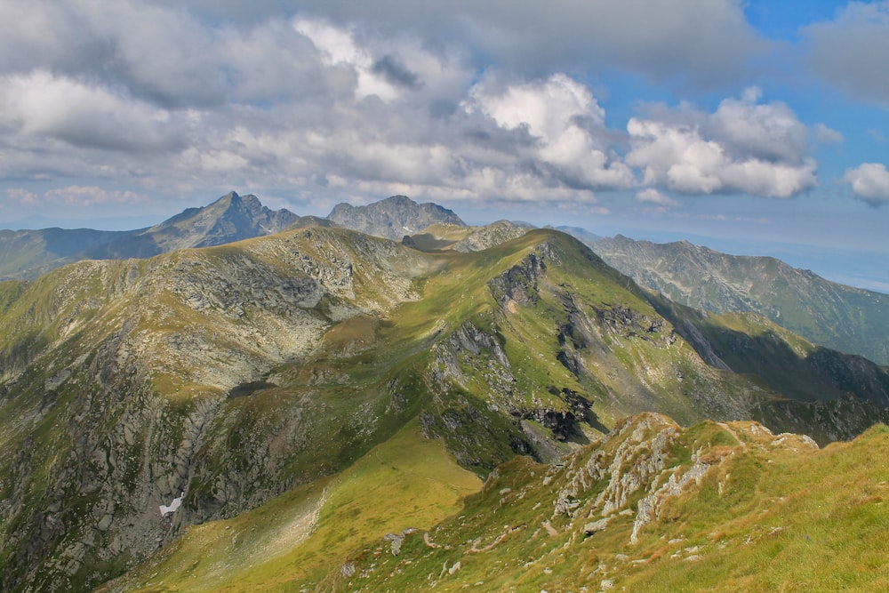 a mountain range with clouds