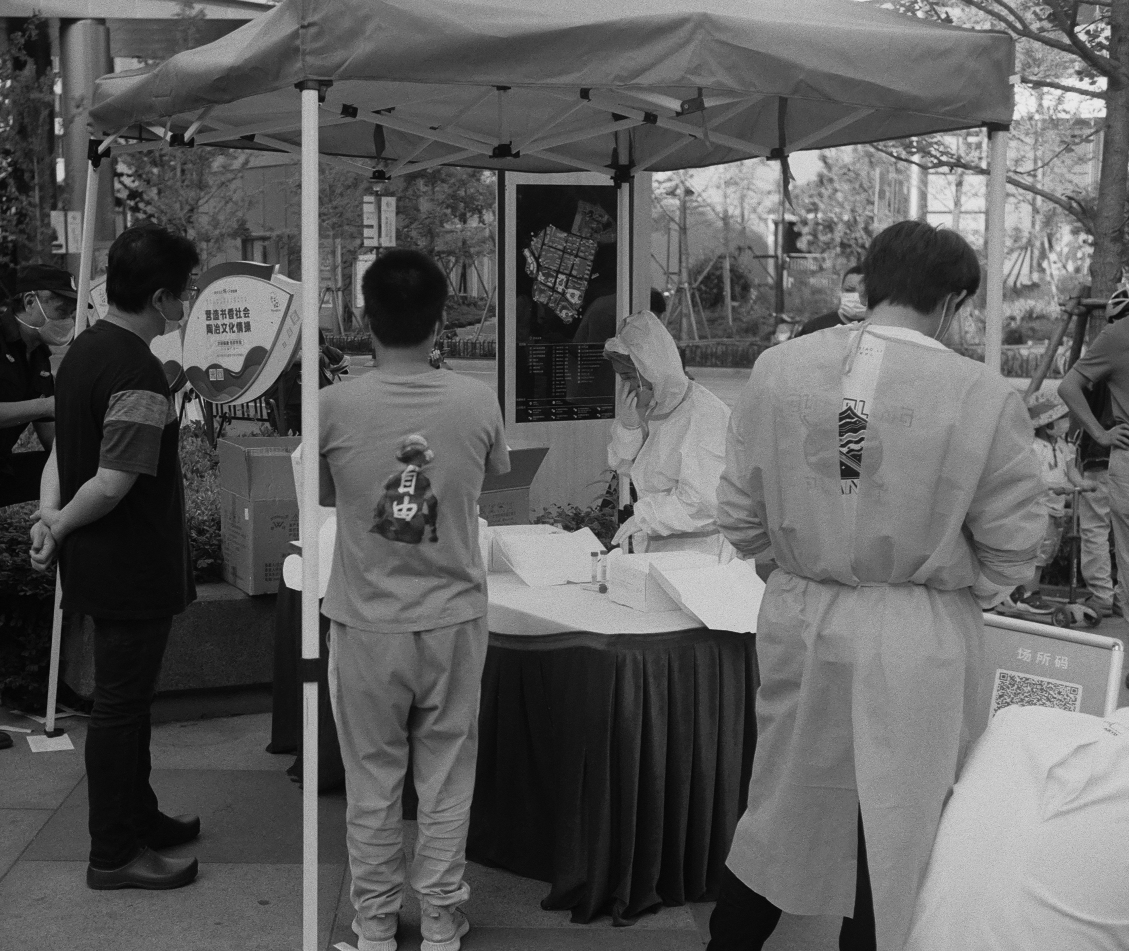 People standing around table