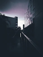 Urban architecture with sharp lines and moody evening light, reflecting creativity.