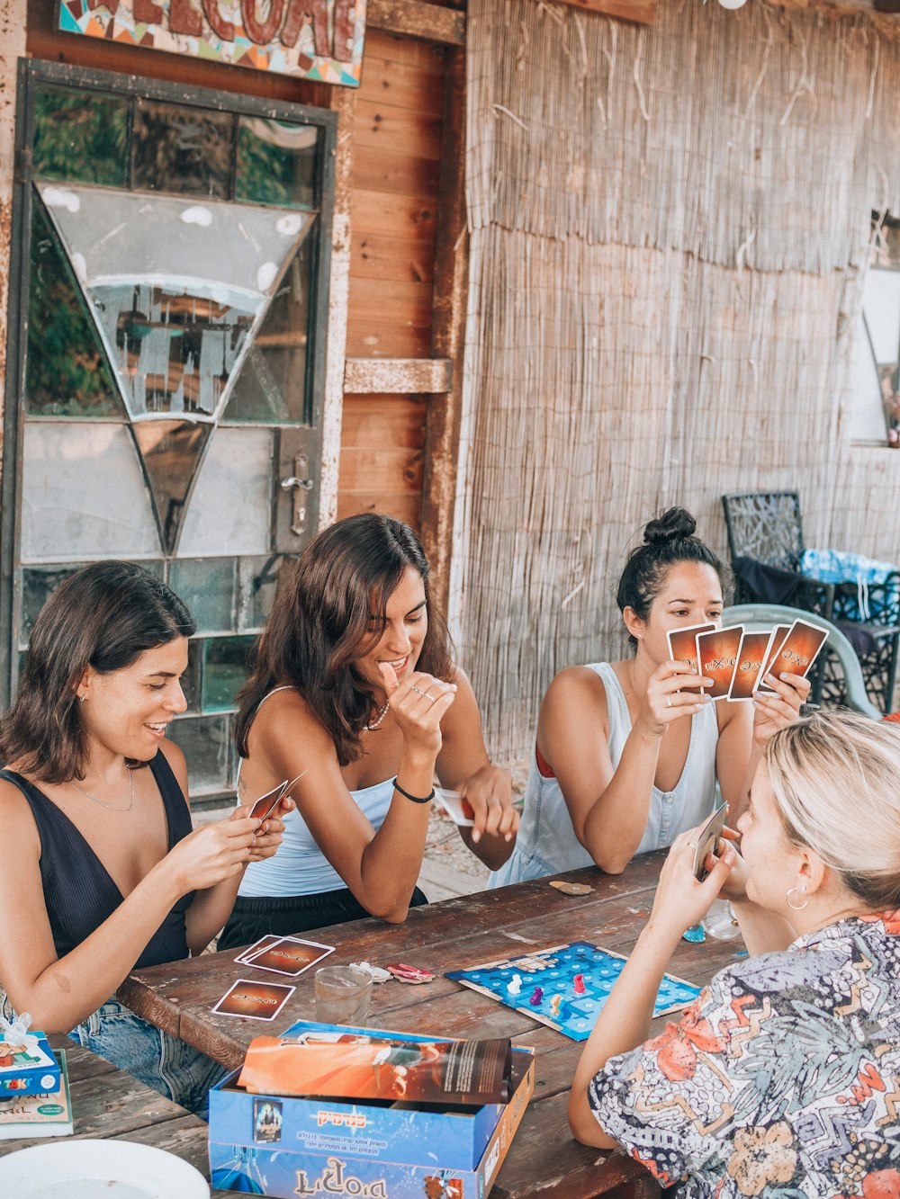 a group of people sitting at a table eating food