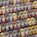 An array of vintage mobile phones, each with a small monochrome screen and physical keypad, is arranged in a pattern. The phones are displayed in multiple colors including red, blue, yellow, and gray, showcasing a nostalgic design typical of early mobile devices.