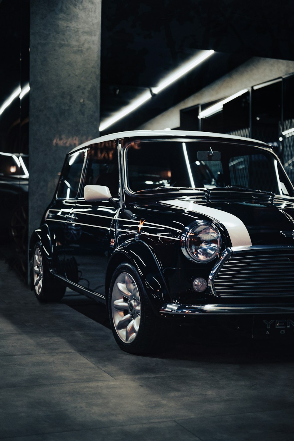 a black car parked in a garage