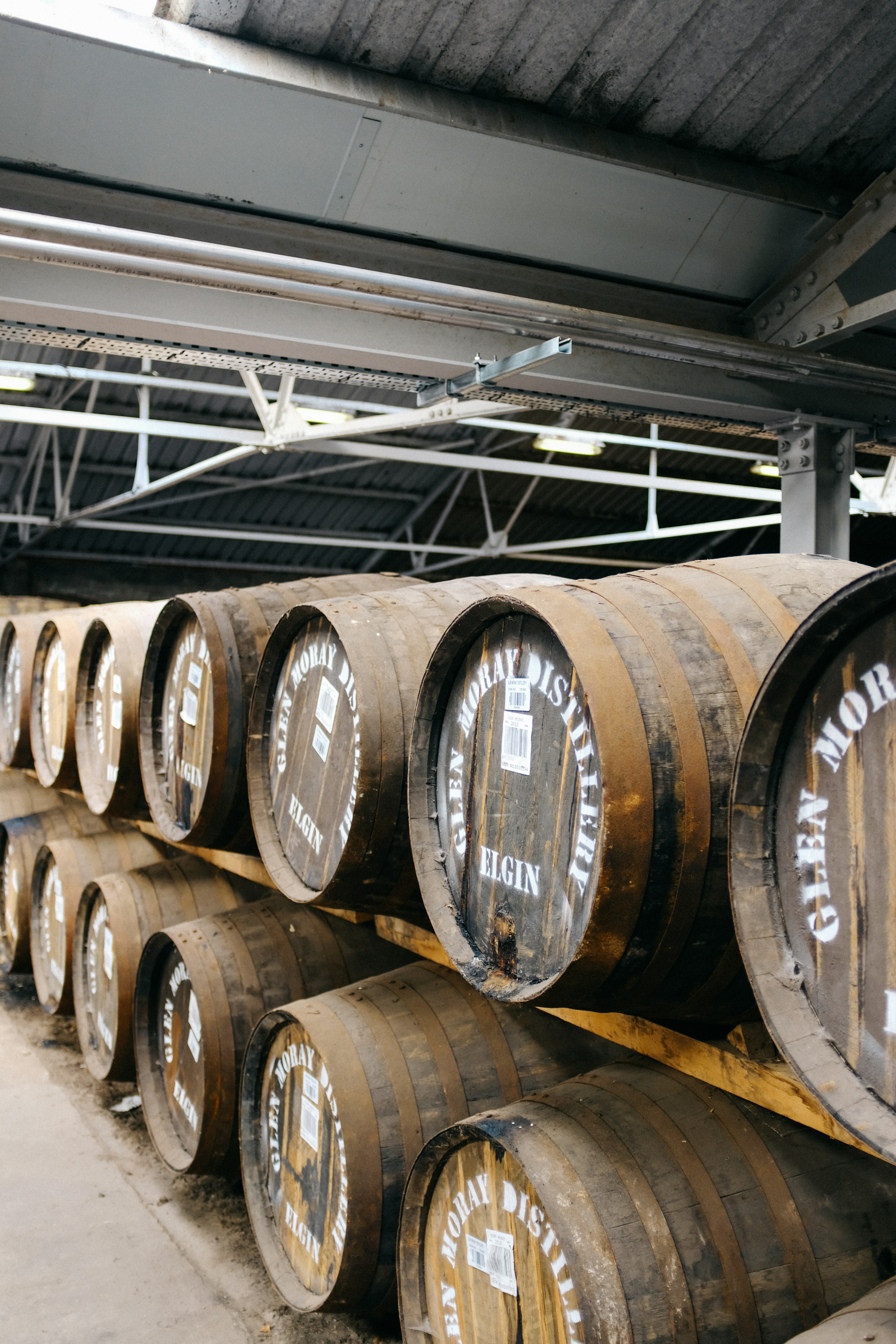 Whisky barrels in a Speyside distillery warehouse Scotland