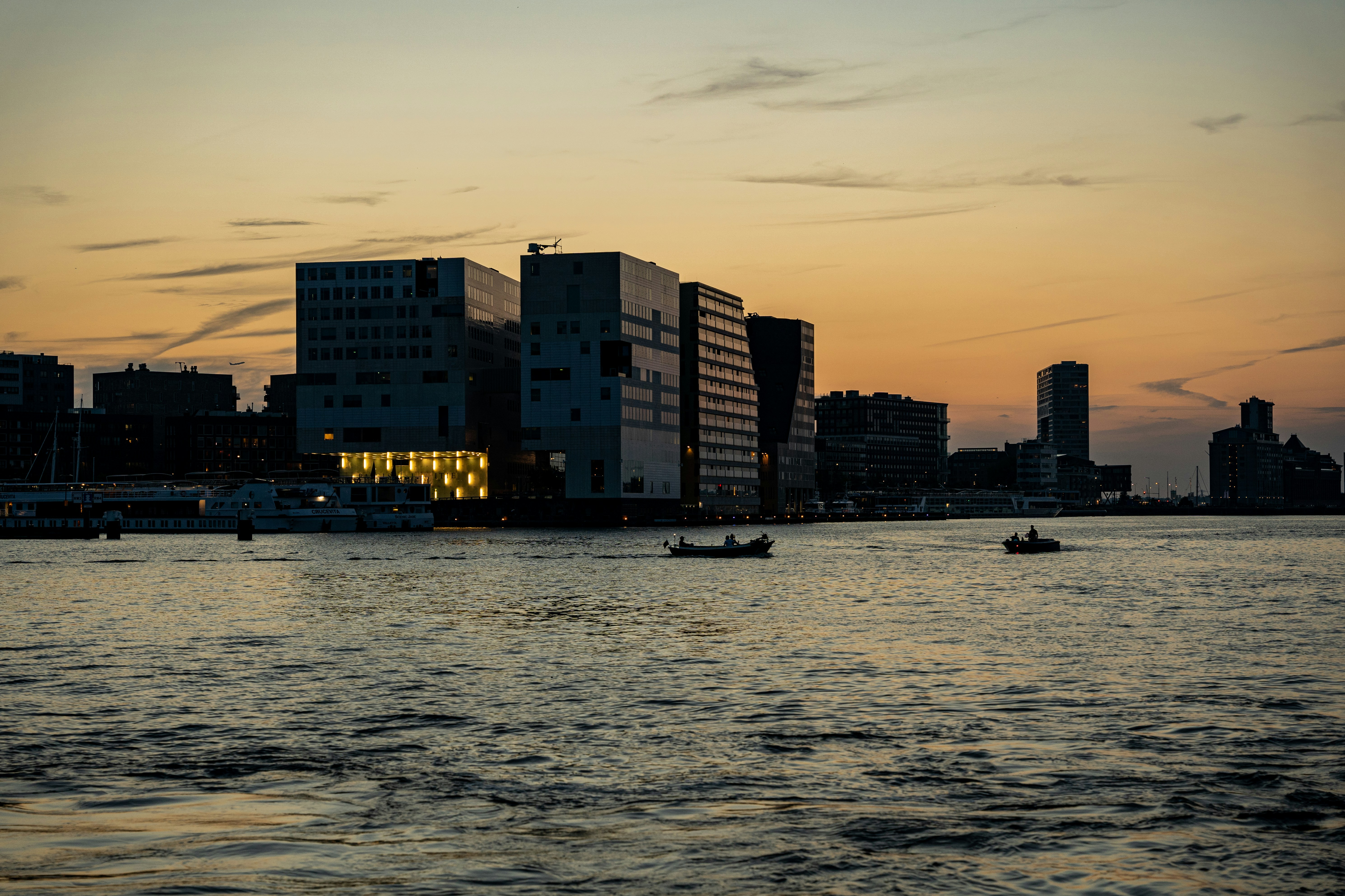 a city skyline with boats, 