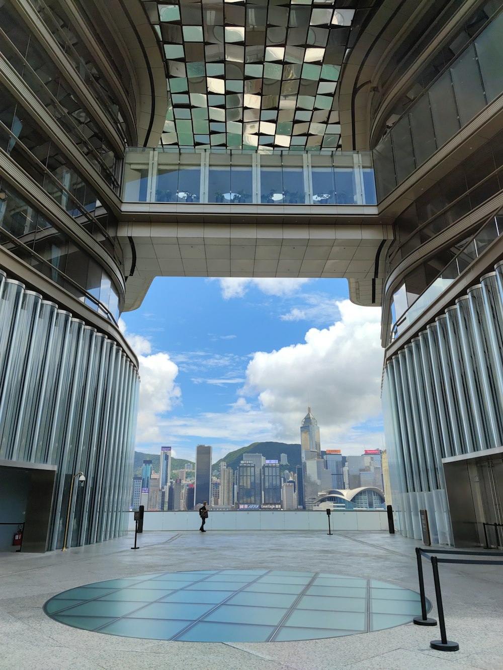 a large courtyard with a large building in the background