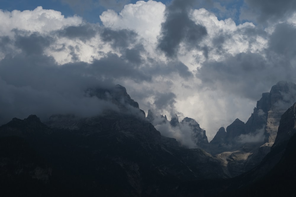 a mountain range with clouds