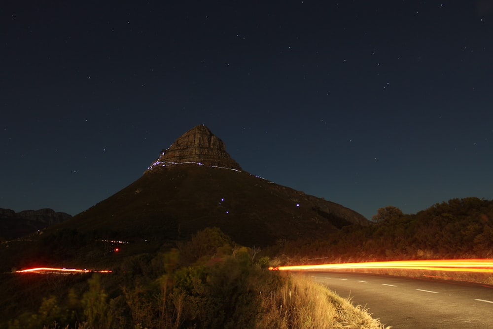 a mountain with lights at night
