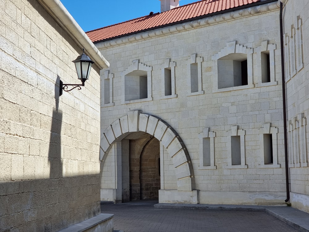 a stone building with a brick archway