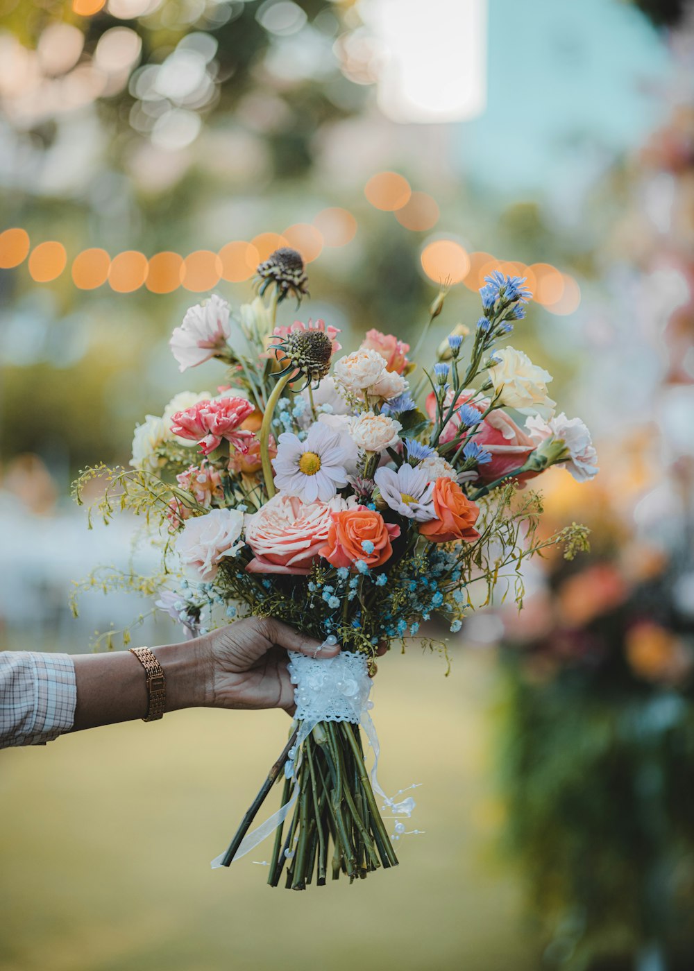 a person holding a bouquet of flowers