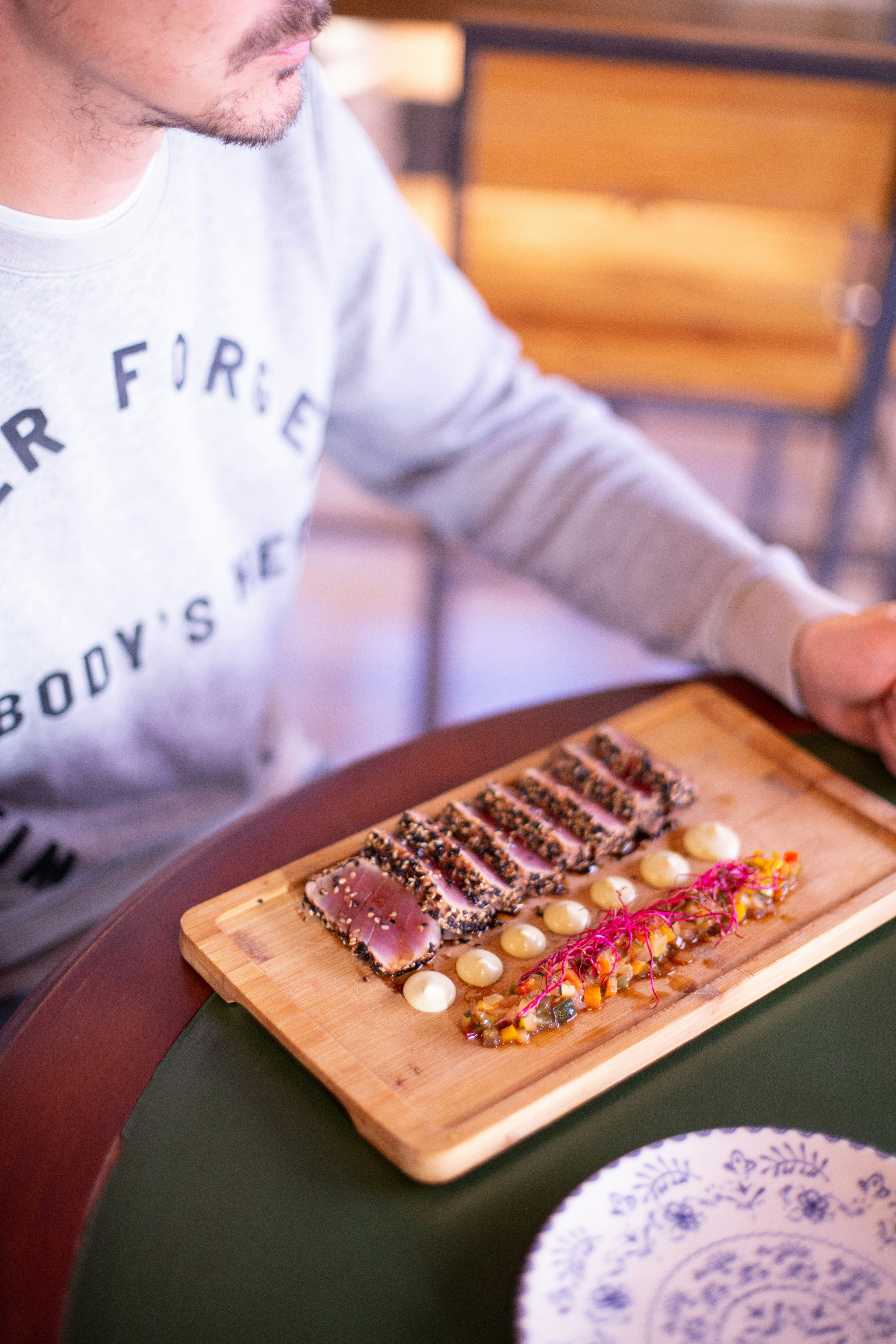 a person holding a tray of food