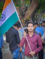 A group of people proudly holding the Tiranga Jhanda.