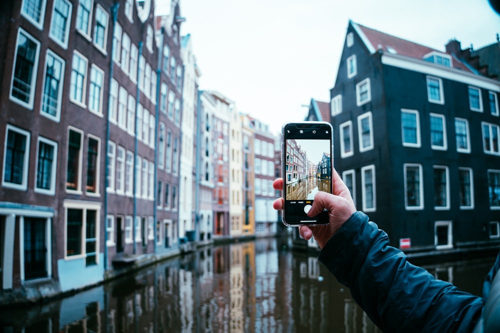 a person holding a glass of beer