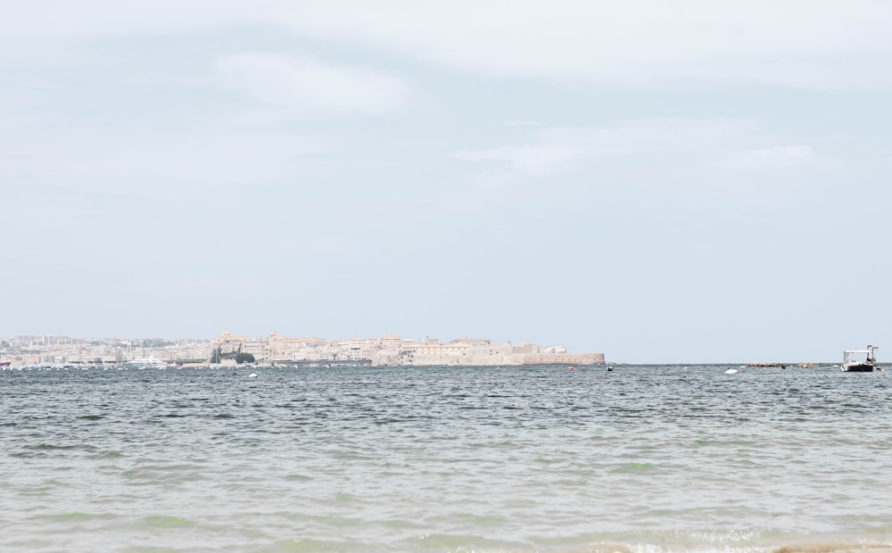 a body of water with a land in the distance