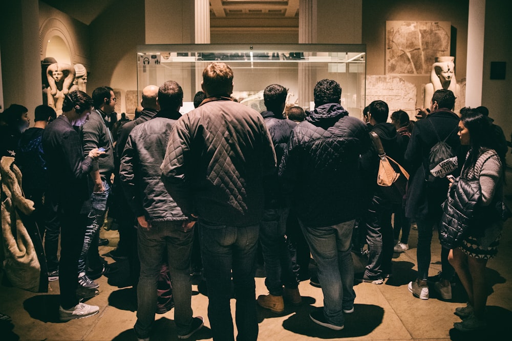 a group of people standing in a room