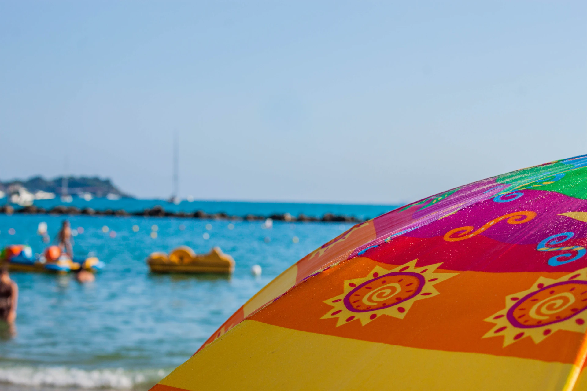 a colorful umbrella on the beach
