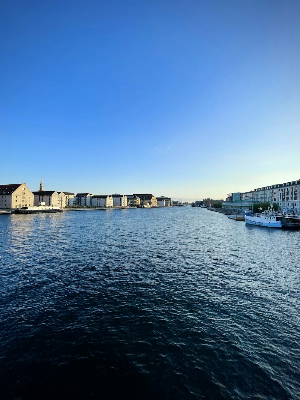 a body of water with buildings along it