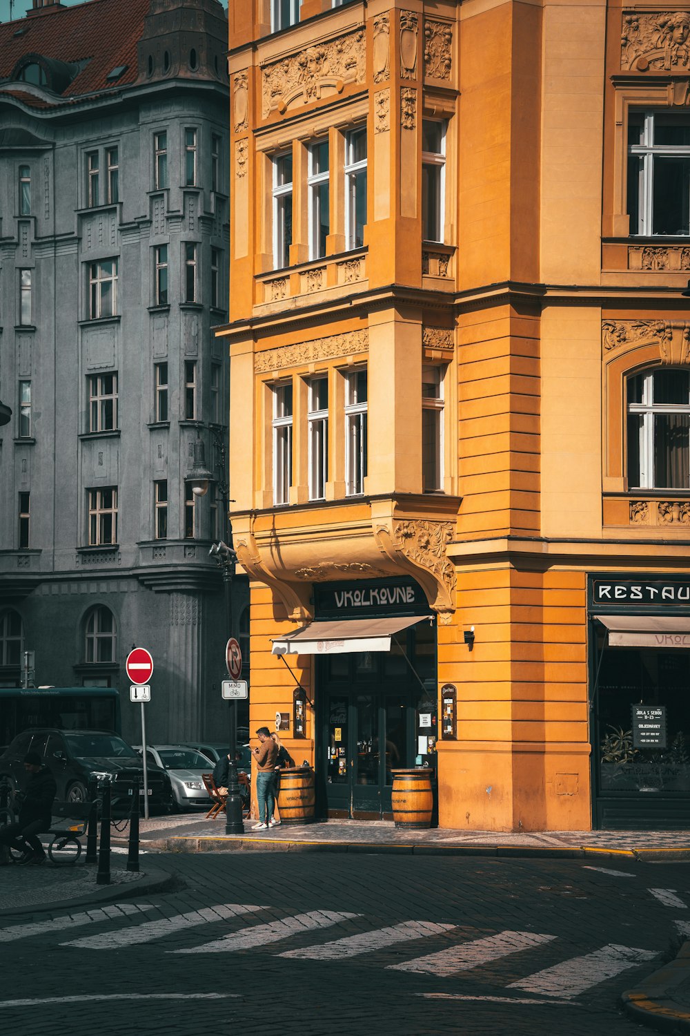 a yellow building with a sign on it