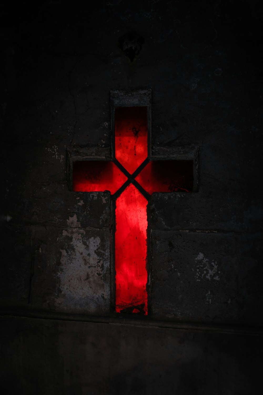 a red cross on a wall