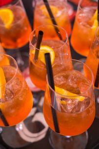 a group of glasses with liquid in them