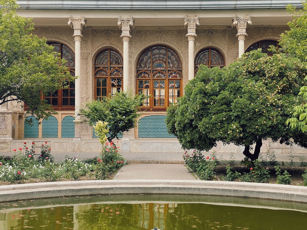 a building with a pond in front of it