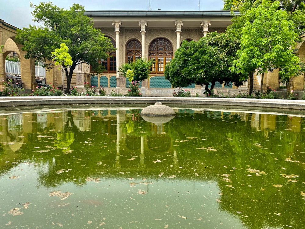 a large building with a fountain in front of it