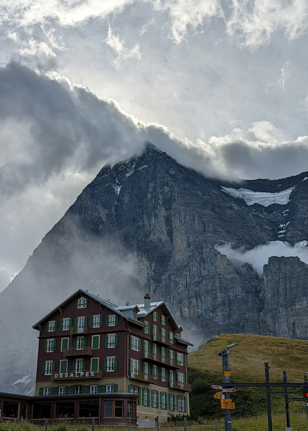 a building with a mountain in the background