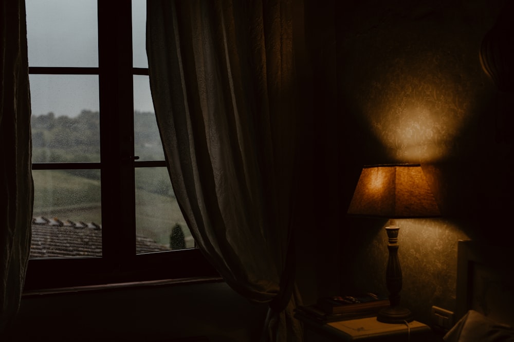 a lamp next to a window