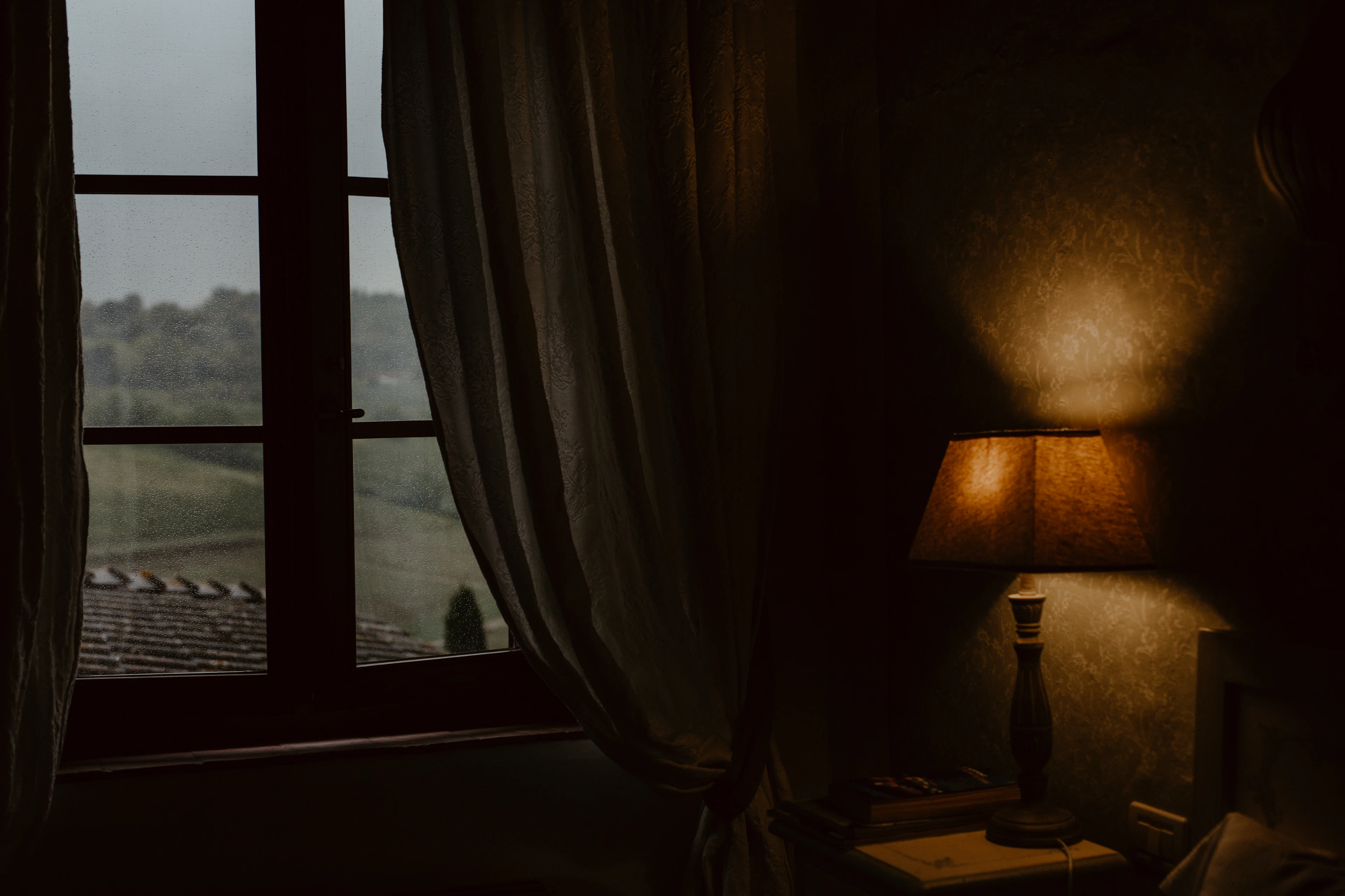 A lamp next to a window