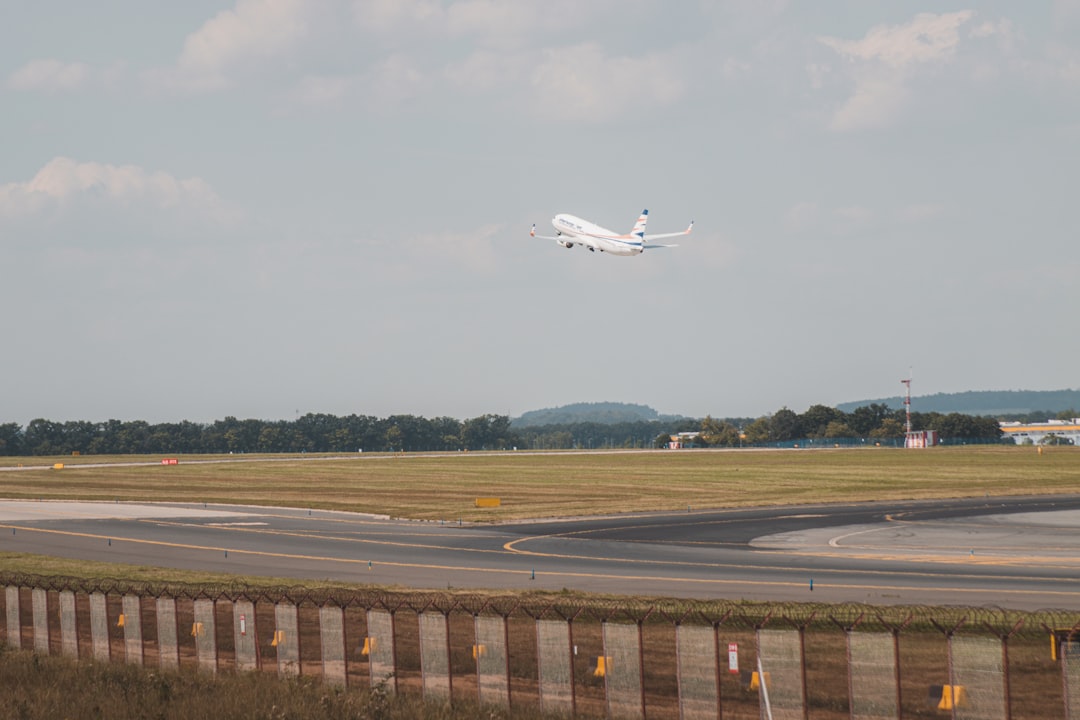 an airplane taking off from a runway,