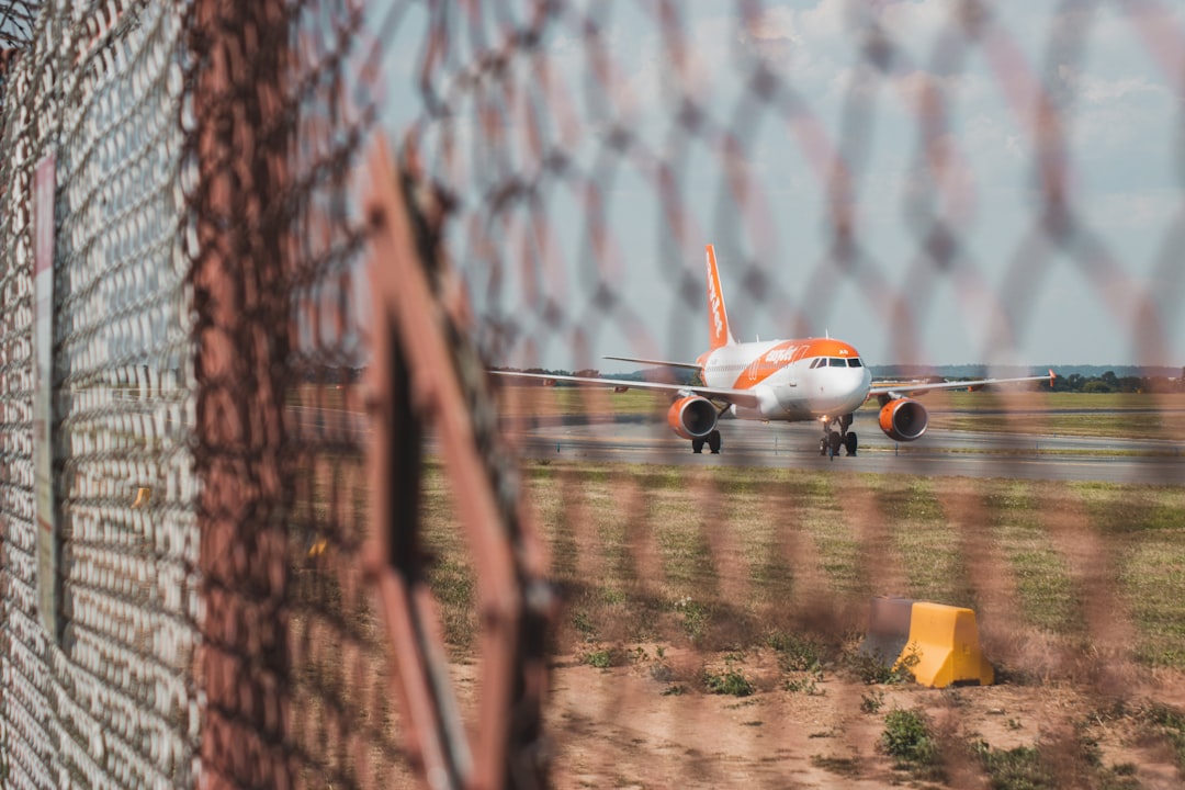 an airplane is parked at an airport,