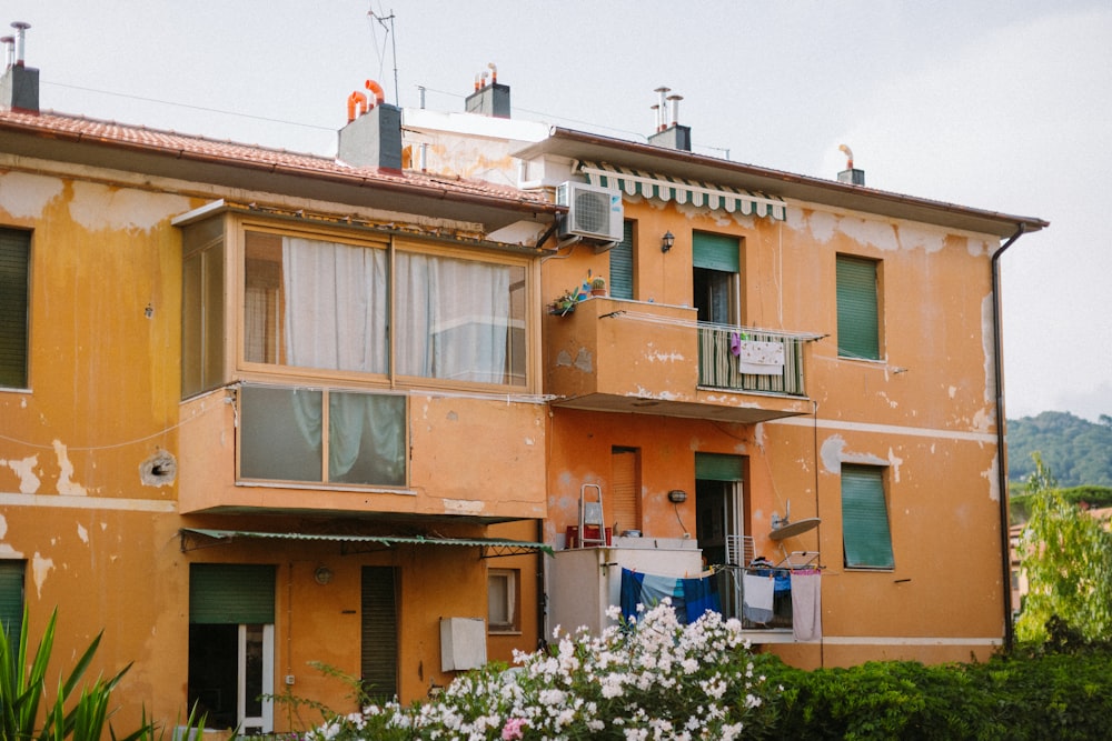 a yellow building with windows