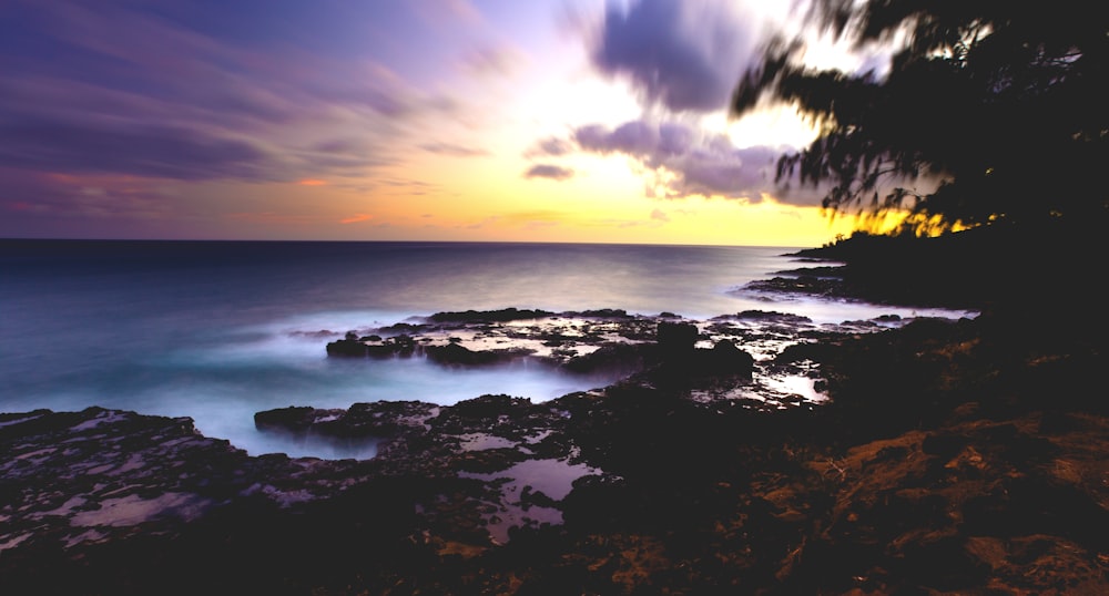 a sunset over a body of water